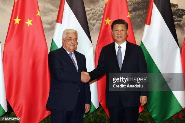 Palestinian President Mahmoud Abbas shakes hands with President of China Xi Jinping ahead of their meeting in Beijing, China on July 18, 2017.