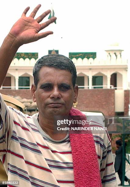 Released Indian prisoner Ram Prakash waves to media representatives as he crosses The India-Pakistan Border at Wagah on July 7, 2008. Prakash, freed...