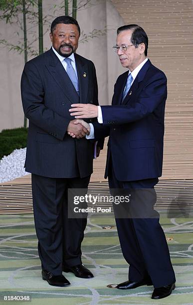 Japanese Prime Minister Yasuo Fukuda welcomes African Union Commission Chairman Jean Ping upon arrival at the Windsor Hotel Toya on July 7, 2008 in...