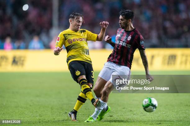 Borussia Dortmund Midfielder Felix Passlack fights for the ball with AC Milan Midfielder Jose Sosa during the International Champions Cup 2017 match...