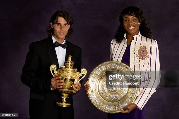 In this handout image provided by the AELTC, Rafael Nadal of Spain, the Winner of the Gentleman's Singles Tennis Wimbledon 2008, and Venus Williams...