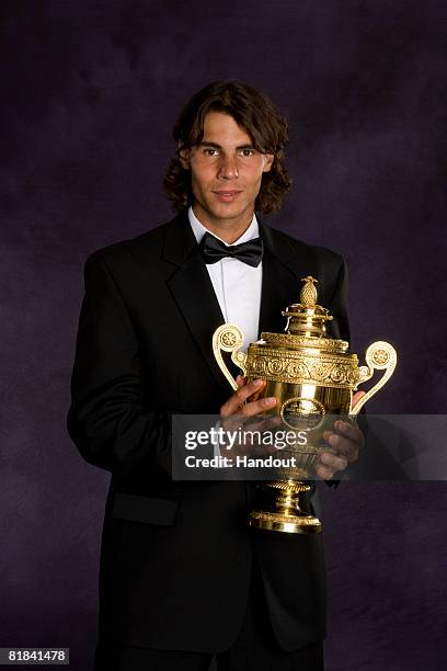 In this handout image provided by the AELTC, Rafael Nadal of Spain, the Winner of the Gentleman's Singles Tennis Wimbledon 2008, poses with the...