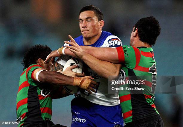 Sonny Bill Williams of the Bulldogs is tackled during the round 17 NRL match between the Bulldogs and the South Sydney Rabbitohs at ANZ Stadium on...