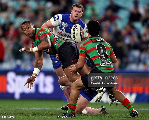 Roy Asotasi of the Bulldogs passes the ball during the round 17 NRL match between the Bulldogs and the South Sydney Rabbitohs at ANZ Stadium on July...