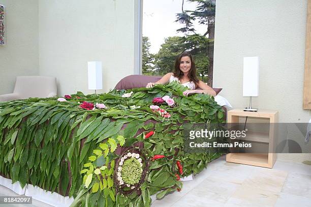 Model poses in an edible bed during the Hampton Court Palace Flower Show on July 7, 2008 in Richmond-upon-Thames, England.