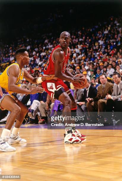 Michael Jordan of the Chicago Bulls looks to pass against the Los Angeles Lakers at the Great Western Forum in Inglewood, California circa 1991. NOTE...