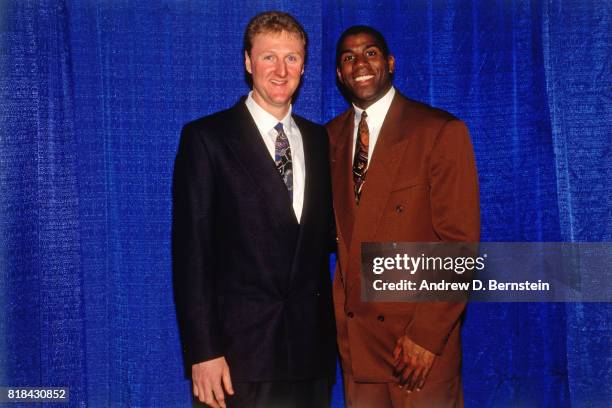 Guard Earvin Johnson of the Los Angeles Lakers poses with Larry Bird at his retirement ceremony at the Great Western Forum in Inglewood, California....