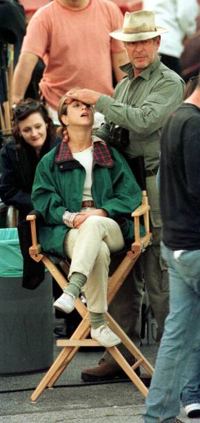 Actress Jennifer Aniston gets a massage by an unidentified crew member on the set of "The Good Girl" March 15, 2001 Glendale, CA.