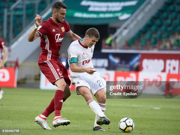Igor Denisov of FC Lokomotiv Moscow vies for the ball with Federico Rasic of FC Arsenal Tula during the Russian Premier League match between FC...