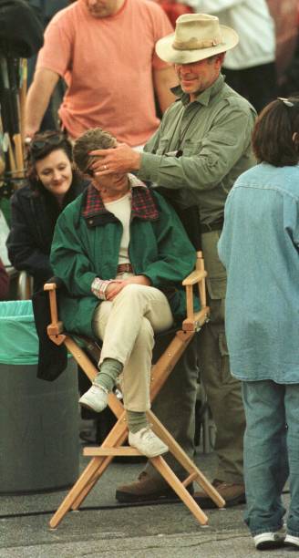 Actress Jennifer Aniston gets a massage by an unidentified crew member on the set of "The Good Girl" March 15, 2001 Glendale, CA.