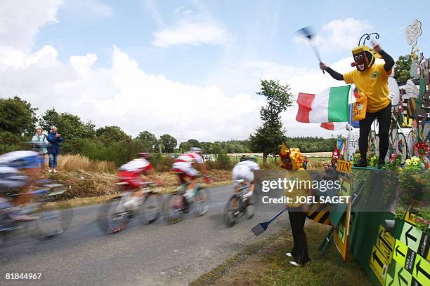 Jean-Pierre Caloini , aka Le Frelon , cheers on the riders, on July 7 2008, during the 208 km third stage of the 2008 Tour de France cycling race run...