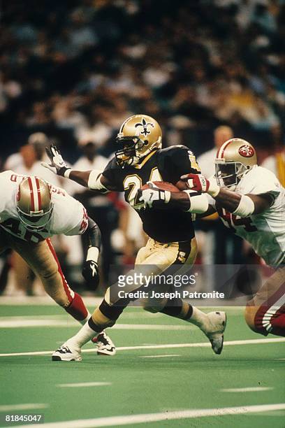 Running back Mario Bates of the New Orleans Saints runs upfield against the San Francisco 49ers at the Superdome on September 3, 1995 in New Orleans,...