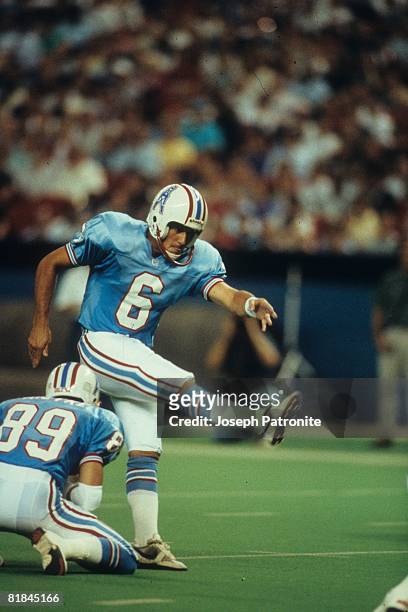 Kicker Ian Howfield of the Houston Oilers kicks a field goal against the Kansas City Chiefs in the Astrodome, in Houston, Texas. The Oilers defeated...