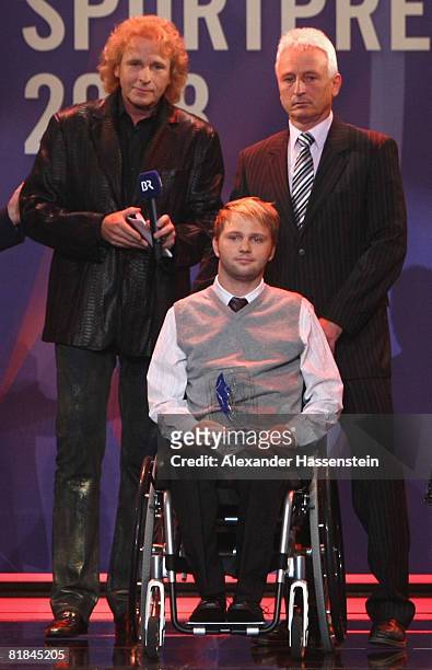 Presenter Thomas Gottschalk poses with Award winner and former wrestler Martin Kittner during the Bavarian Sport Award 2008 at the International...
