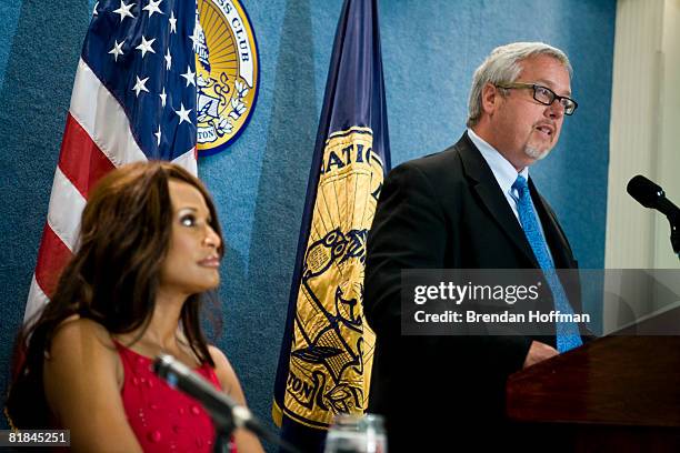 Larry Jones, president of the network TV Land, speaks with former model Beverly Johnson at a news conference July 7, 2008 in Washington, DC. The news...