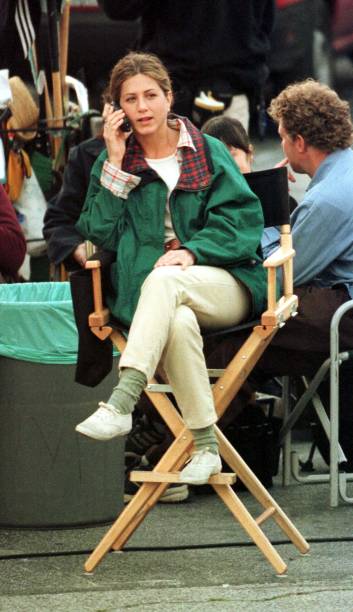 Actress Jennifer Aniston speaks on her cell phone on the set of "The Good Girl" March 15, 2001 Glendale, CA.