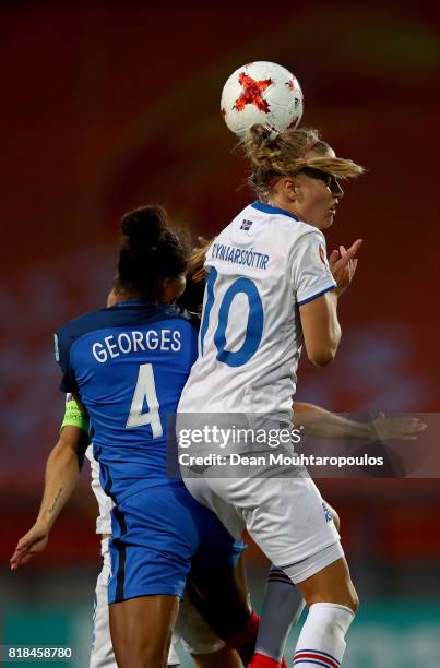 Laura Georges of France and Dagný Brynjarsdóttir of Iceland head for the ball during the Group C match between France and Iceland during the UEFA...