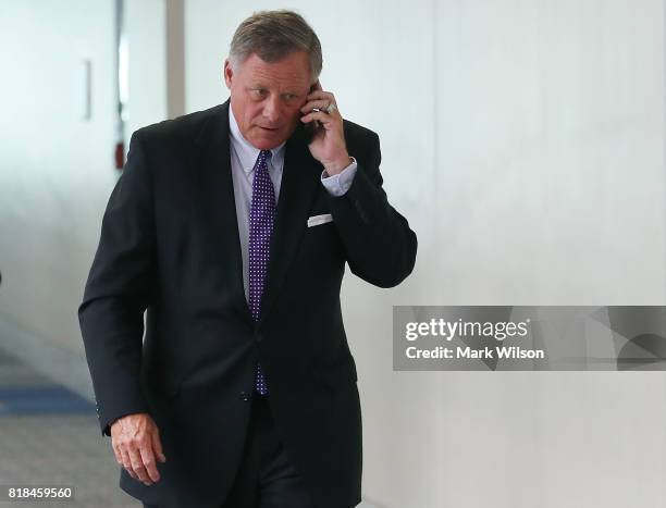Sen. Richard Burr , Chairman of the Senate Select Committee on Intelligence talks on his phone as he walks to a closed committee meeting on Capitol...