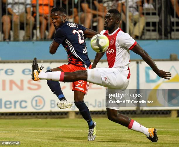 Lyon's French forward Maxwel Cornet vies with Ajax defender Davinson Sanchez during a friendly football match between Olympique Lyonnais and Ajax...