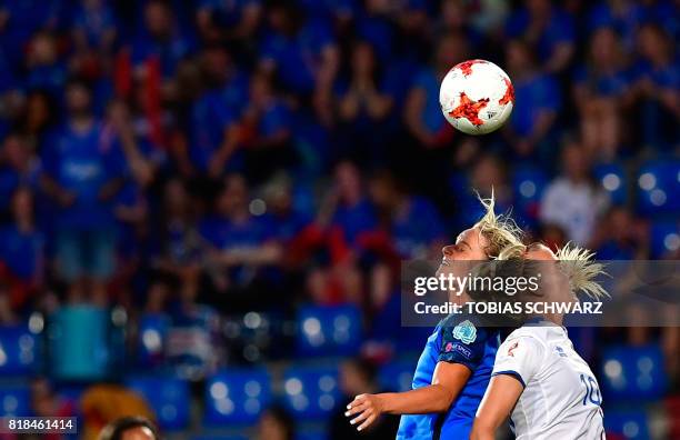 France's midfielder Amandine Henry vies with Iceland's midfielder Dagny Brynjarsdottir during the UEFA Women's Euro 2017 football match between...