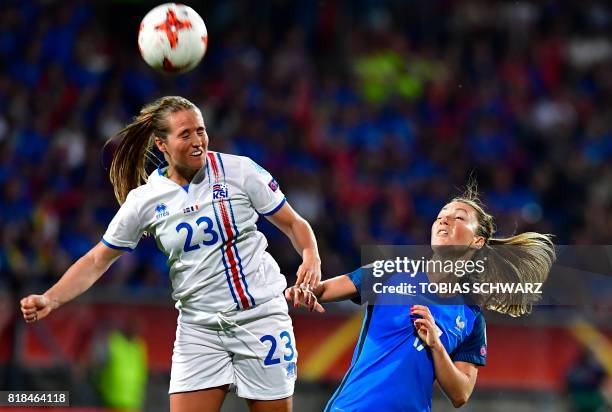 France's midfielder Gaetane Thiney and Iceland's forward Fanndis Fridriksdottir go for a header during the UEFA Women's Euro 2017 football tournament...