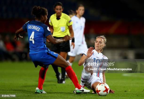 Laura Georges of France and Dagný Brynjarsdóttir of Iceland compete for the ball during the Group C match between France and Iceland during the UEFA...