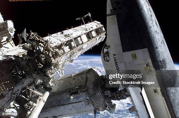 space shuttle docked to the international space station. - space station stock pictures, royalty-free photos & images