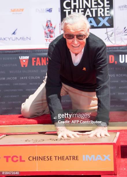 Comic-book writer, editor, and publisher Stan Lee places his hands in cement during his hand and footprint ceremony at TCL Chinese Theatre IMAX, on...