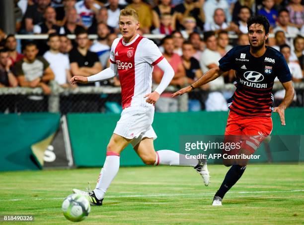 Ajax defender Matthijs de Ligt vies with Lyon's French midfielder Clement Grenier during a friendly football match between Olympique Lyonnais and...