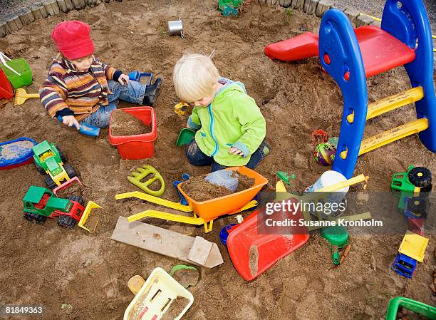 a child playing in a sandpit sweden. - 2 kid in a sandbox fotografías e imágenes de stock