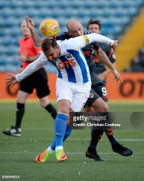 Kilmarnock captain Kris Boyd battles to get away from Clyde's Kevin Nicol during the Betfred League Cup game on July 18, 2017 in Kilmarnock, Scotland.