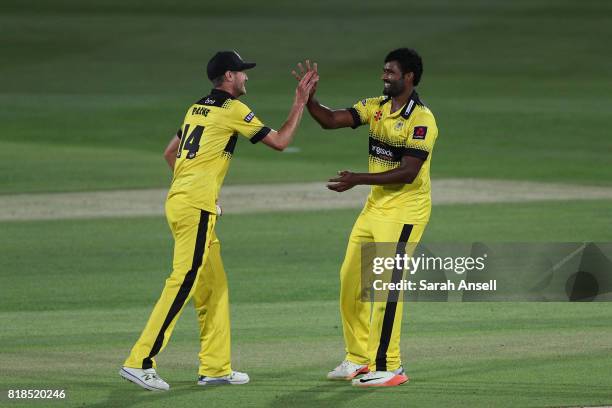 Thisara Perera of Gloucestershire celebrates with teammate David Payne after bowling James Tredwell of Kent Spitfires to wrap up victory at the end...