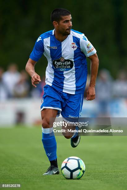 Juanfran Moreno of Deportivo de La Coruna runs with the ball during the pre-season friendly match between Cerceda and Deportivo de La Coruna at O...