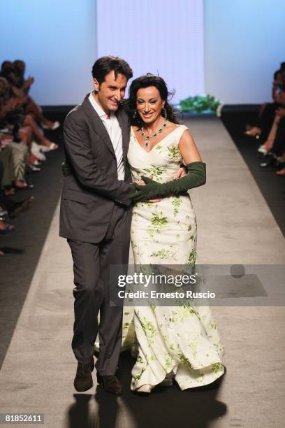 Ettore Bilotta and Nancy Dall' Olio walks the runway during Ettore Bilotta Haute Couture fashion show as part of Rome fashion week in Santo Spirito...