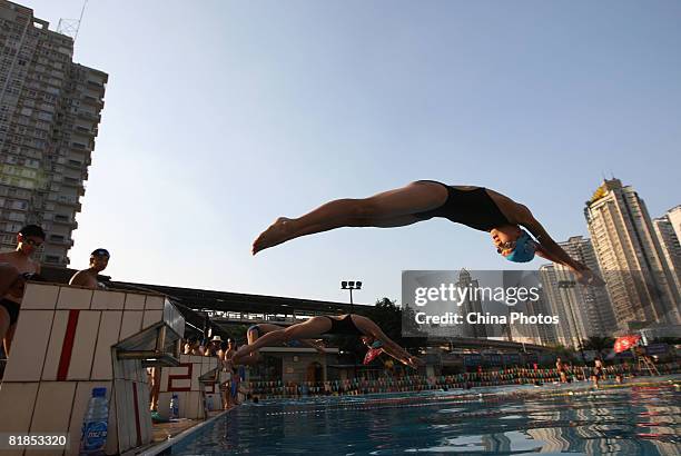 Children practice swimming during a training session at the Jiulong Square Swimming Centre on July 7, 2008 in Chongqing Municipality, China. Swimming...