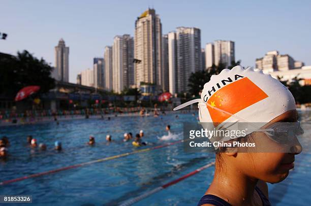 Children practice swimming during a training session at the Jiulong Square Swimming Centre on July 7, 2008 in Chongqing Municipality, China. Swimming...