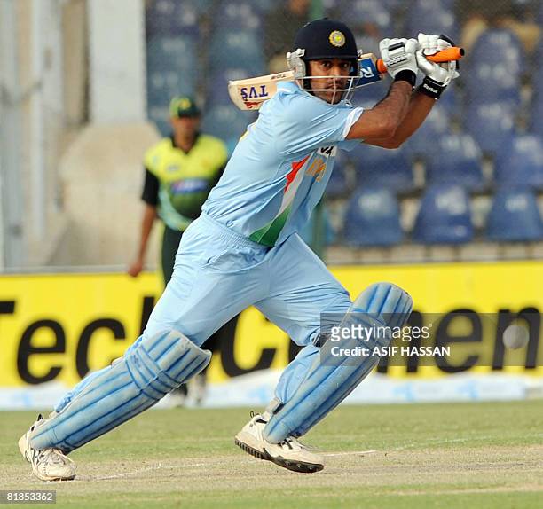 In this picture taken on July 2 Indian cricket captain Mahendra Singh Dhoni plays a shot during the Super League Asia Cup match between Pakistan and...