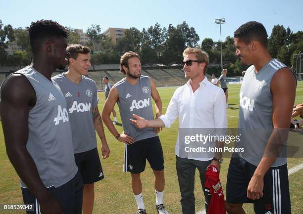 Axel Tuanzebe, Victor Lindelof and Daley Blind and Chris Smalling of Manchester United meet Formula One world champion Nico Rosberg ahead of a first...