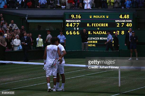 Rafael Nadal of Spain shakes hands with Roger Federer of Switzerland after Nadal won in five sets in the final on day thirteen of the Wimbledon Lawn...