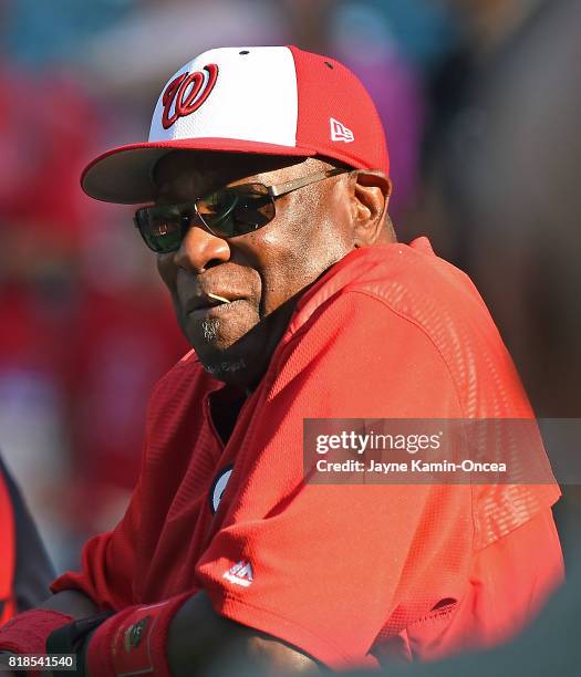 Dusty Baker, manager of the Washington Nationals, leans on the batting cage before the game against the Los Angeles Angels at Angel Stadium of...