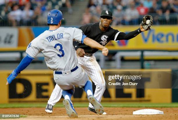 Tim Anderson of the Chicago White Sox catches the ball before tagging out Chris Taylor of the Los Angeles Dodgers for the second out of a double play...
