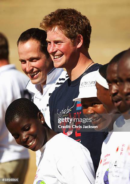 Prince Harry laughs as he takes part in a game highlighting HIV/AIDS awareness on July 8, 2008 in Buthe Buthe, Lesotho. Prince Harry and 26 soldiers...