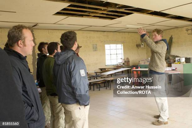 Prince Harry briefs members of the Burnaby Blue expedition at the Thuso Centre on July 6, 2008 in Butha Buthe, Lesotho. The young royal and more than...