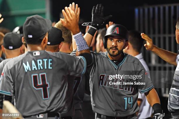 Reymond Fuentes of the Arizona Diamondbacks celebrates in the dugout after hitting a pinch hit three-run home run in the seventh inning against the...