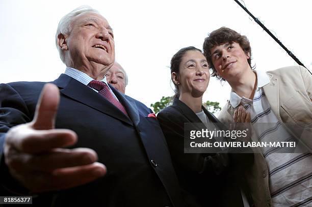 French-Colombian politician Ingrid Betancourt and her son Lorenzo speak with French Senate president Christian Poncelet as they arrive to attend a...