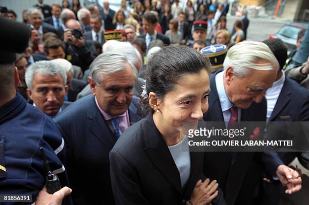 French-Colombian politician Ingrid Betancourt arrives to attend a ceremony in her honor accompanied by French Senate president Christian Poncelet and...