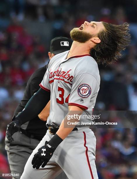 Bryce Harper of the Washington Nationals reacts after he was tagged out at second base going for a double in the third inning of the game against the...