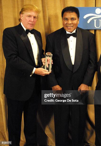 Muhammad Ali is honored March 14, 2001 and receives The UCP's Humanitarian Award from Donald Trump at the United Cerebral Palsey dinner at the New...