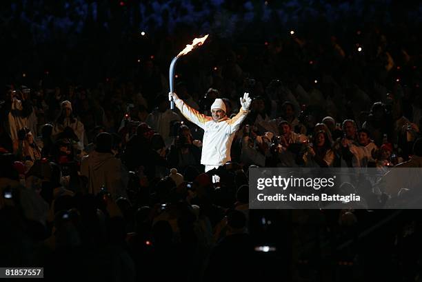Opening Ceremony: 2006 Winter Olympics, Former Italian skier Alberto Tomba carrying Olympic torch before games, Torino, Italy 2/10/2006