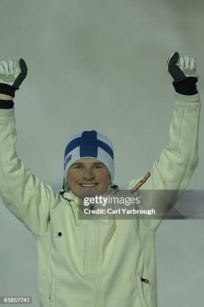 Freestyle Skiing: 2006 Winter Olympics, Closeup of Finland Mikko Ronkainen victorious on medal stand after winning Moguls Final silver medal at...